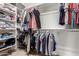 Walk-in closet providing ample storage and organization for clothing and accessories at 229 E Alcatara Ave, Queen Creek, AZ 85140