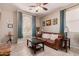 Cozy living room features neutral walls, modern decor, and an inviting leather sofa at 229 E Alcatara Ave, Queen Creek, AZ 85140