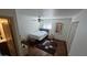 Bedroom with wood floors, a ceiling fan, an ensuite bathroom, and natural light at 239 E Betty Elyse Ln, Phoenix, AZ 85022