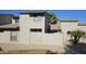 Exterior view of townhome, featuring private courtyard with gate at 239 E Betty Elyse Ln, Phoenix, AZ 85022