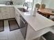 Kitchen with stainless steel dishwasher and fixtures plus white quartz countertops at 239 E Betty Elyse Ln, Phoenix, AZ 85022