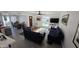 Bright living room with neutral decor and large windows at 239 E Betty Elyse Ln, Phoenix, AZ 85022