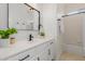 This is a bathroom featuring a vanity with black fixtures and a shower/tub combo at 24812 S Pleasant Ct, Sun Lakes, AZ 85248