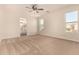 Large primary bedroom features neutral carpeting, large windows, and an ensuite bathroom at 24812 S Pleasant Ct, Sun Lakes, AZ 85248