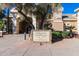 Oakwood Clubhouse entrance with well-maintained landscaping, showcasing a welcoming community hub at 24812 S Pleasant Ct, Sun Lakes, AZ 85248