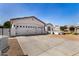 Home exterior with a large three car garage with white doors and a red tile roof at 24812 S Pleasant Ct, Sun Lakes, AZ 85248