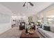 Open-concept living space with neutral decor, abundant natural light, and modern furnishings at 24812 S Pleasant Ct, Sun Lakes, AZ 85248