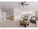 Inviting living room featuring neutral tones, an open layout, and seamlessly connects to the kitchen at 24812 S Pleasant Ct, Sun Lakes, AZ 85248