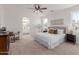 This is the main bedroom with a stylish bed, and windows that let in tons of natural light at 24812 S Pleasant Ct, Sun Lakes, AZ 85248