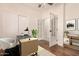 Stylish home office with hardwood floors, french doors, and modern decor at 24812 S Pleasant Ct, Sun Lakes, AZ 85248
