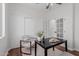 Bright office space featuring a desk, chair, closet, and French doors leading to another room at 24812 S Pleasant Ct, Sun Lakes, AZ 85248