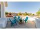 Inviting front patio with comfortable seating, a charming rug, and a peaceful neighborhood view at 24812 S Pleasant Ct, Sun Lakes, AZ 85248