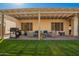 Cozy outdoor seating area with pergola offers a perfect spot for relaxation and entertainment at 26991 N 97Th Ln, Peoria, AZ 85383