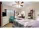Inviting bedroom with ceiling fan, accent furnishings, and a cozy decor at 26991 N 97Th Ln, Peoria, AZ 85383