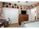Bedroom featuring curated wall decor, ceiling fan, and a cozy bed at 26991 N 97Th Ln, Peoria, AZ 85383