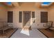 Cozy front porch with comfortable seating and decorative details at 26991 N 97Th Ln, Peoria, AZ 85383