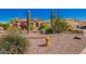 Inviting single-story home showcasing xeriscaping, desert plants, and stone accents at 26991 N 97Th Ln, Peoria, AZ 85383