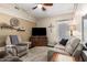 Comfortable living room with ceiling fan, recessed lighting, and neutral colored walls and furniture at 26991 N 97Th Ln, Peoria, AZ 85383
