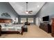 Spacious main bedroom with sitting area and large windows at 26991 N 97Th Ln, Peoria, AZ 85383