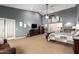 Expansive main bedroom featuring a seating area, walk-in closet, and ample natural light at 26991 N 97Th Ln, Peoria, AZ 85383