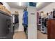 Well-organized walk-in closet with built-in shelving and secure gun safe at 26991 N 97Th Ln, Peoria, AZ 85383