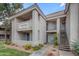 Multi-level condo showcasing charming architectural details, terra cotta roof, and landscaped entryway at 2929 W Yorkshire Dr # 2013, Phoenix, AZ 85027