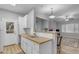 Bright kitchen featuring white cabinets, butcher block countertops, and modern appliances at 2929 W Yorkshire Dr # 2013, Phoenix, AZ 85027