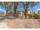 Charming single-story home with a two-car garage, desert landscaping, and a tile roof at 30411 N 42Nd Pl, Cave Creek, AZ 85331