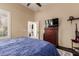 Comfortable main bedroom with a view of the ensuite bathroom and ample natural light from the window at 30411 N 42Nd Pl, Cave Creek, AZ 85331