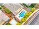 Aerial view showcasing a backyard pool, spa, patio area, and verdant landscaping surrounding a beautiful home at 3220 N 136Th Dr, Avondale, AZ 85392