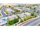 A wide aerial view of houses with pools and landscaping in a suburban neighborhood at 3220 N 136Th Dr, Avondale, AZ 85392