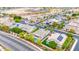 A high-angle view showcasing a residential area with homes, streets, and solar panels on rooftops at 3220 N 136Th Dr, Avondale, AZ 85392