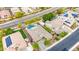 An aerial view reveals a beautiful home with a swimming pool, spa, verdant landscaping, and a spacious backyard at 3220 N 136Th Dr, Avondale, AZ 85392