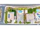 A top-down perspective of several homes with manicured yards and a pool in a residential neighborhood at 3220 N 136Th Dr, Avondale, AZ 85392