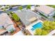 A serene backyard featuring a private pool and spa, with lush landscaping providing a tranquil retreat at 3220 N 136Th Dr, Avondale, AZ 85392