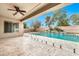 Enjoyable backyard featuring covered patio, pool, and spa; the perfect layout for relaxing and entertaining guests at 3220 N 136Th Dr, Avondale, AZ 85392