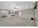 Spacious finished basement with neutral carpet, recessed lighting, and a built-in media center at 3220 N 136Th Dr, Avondale, AZ 85392