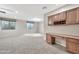 Basement featuring neutral carpet, built in cabinetry, and above ground windows at 3220 N 136Th Dr, Avondale, AZ 85392
