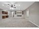 Spacious finished basement with neutral carpet, recessed lighting, and a built-in media center at 3220 N 136Th Dr, Avondale, AZ 85392