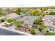 A front aerial view of a home with a tile roof and manicured landscaping in a suburban neighborhood at 3220 N 136Th Dr, Avondale, AZ 85392