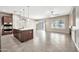 Open kitchen and dining area with a large island, stainless steel appliances, and a seamless flow to the living space at 3220 N 136Th Dr, Avondale, AZ 85392