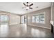 Bright and airy living room with backyard access and fireplace, seamlessly connecting to the kitchen and dining spaces at 3220 N 136Th Dr, Avondale, AZ 85392