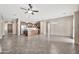 Spacious living room with tile floors connects to the kitchen and entry, offering ample space for relaxation and entertainment at 3220 N 136Th Dr, Avondale, AZ 85392