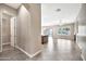 The entryway and living space flow together, featuring tile floors and views of the kitchen and pool area at 3220 N 136Th Dr, Avondale, AZ 85392