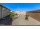 Backyard featuring low-maintenance landscaping and a perfect blank canvas for entertaining at 36708 N Petra Dr, San Tan Valley, AZ 85143