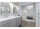 Bright bathroom featuring double sinks and modern fixtures, adjacent to primary bedroom at 36708 N Petra Dr, San Tan Valley, AZ 85143