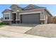 Beautiful single-Gathering home showcasing a two-car garage and inviting curb appeal at 36708 N Petra Dr, San Tan Valley, AZ 85143
