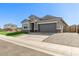 Charming single-story home featuring a well-manicured lawn, a two-car garage and neutral color palette at 36708 N Petra Dr, San Tan Valley, AZ 85143