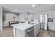 Bright kitchen with a quartz countertop island, perfect for food preparation at 36708 N Petra Dr, San Tan Valley, AZ 85143