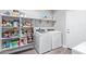 Laundry area featuring washer, dryer and lots of shelving at 36708 N Petra Dr, San Tan Valley, AZ 85143